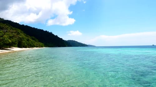 Beach Turquoise Sea Water in Tropical Country in Hot Summer Day with Blue Sky