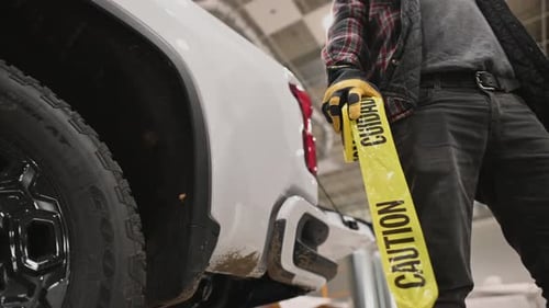 Contractor Worker with Yellow Warning Tape