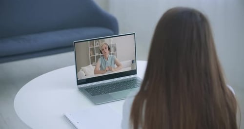 Woman Talking on Video Call on Laptop