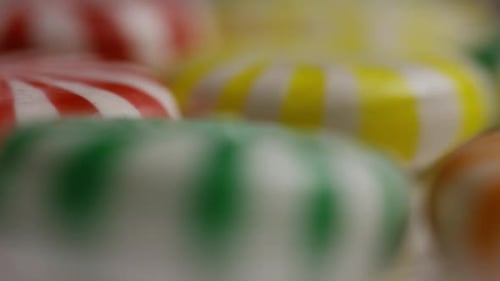 Rotating shot of a colorful mix of various hard candies - CANDY MIXED 037