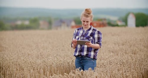 Portrait of Female Farmer with Digital Tablet at Farm