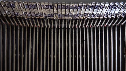 Mechanism of a retro typewriter. Old typewriter hammers. Close up.