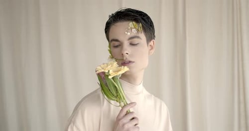 Young Adult Holding Flowers Close Up