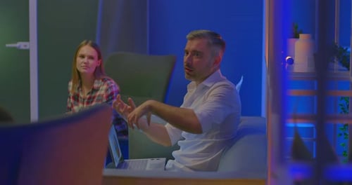 Group Having Discussion in Modern Office Setting