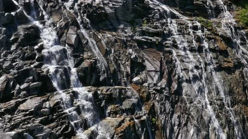 Small Waterfall on Stone Wall, Austria