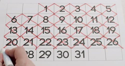 Crossing Out Days on Calendar with Marker