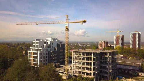 Aerial view of high residential apartment buildings under construction. Real estate development.