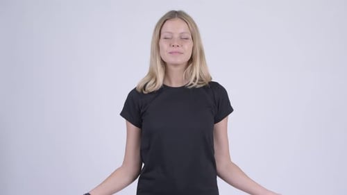 Fair-Haired Woman Meditates with Extended Arms
