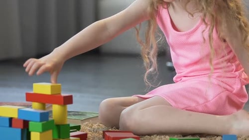 Early Education, Smart Female Kid Playing With Toy Blocks at Home, Childhood