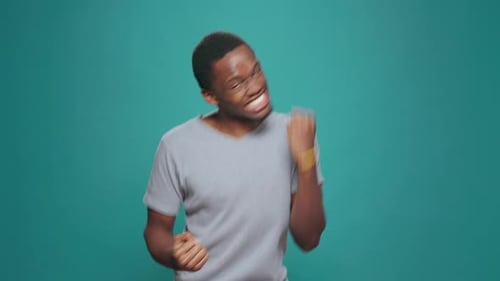 Enthusiastic Young Adult Man Celebrating Success