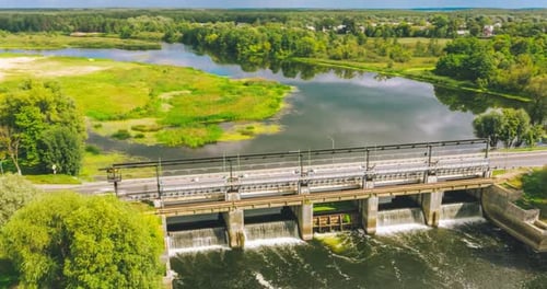 Hyperlapse From a Drone Overlooking a Bridge with a Dam