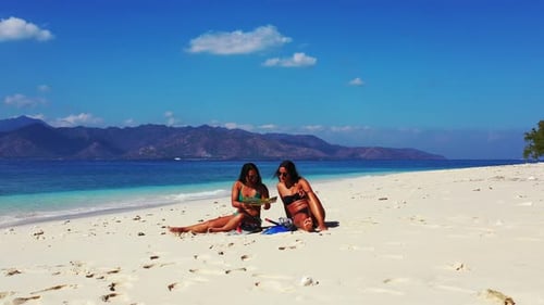 Beautiful fun women on vacation spending quality time at the beach on paradise white sand and blue 4
