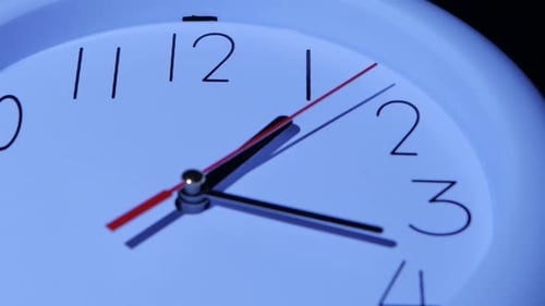 Business White Clock Closeup on White Background
