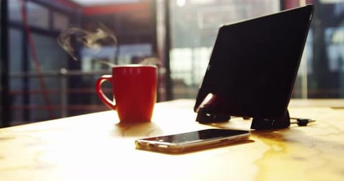 Tablet, Phone and Coffee Cup on Desk