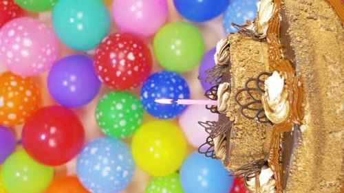 Birthday Cake with Candle and Balloons Decoration