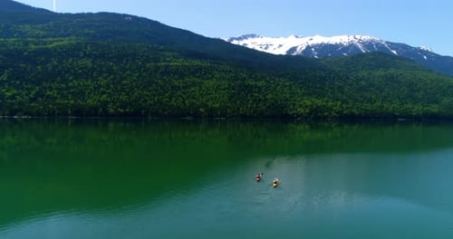 People kayaking in lake 4k
