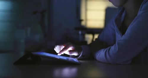 Working on tablet computer at home