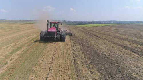 Aerial view of tractor plowing a field
