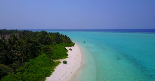 Wide birds eye abstract shot of a white sandy paradise beach and aqua blue water background