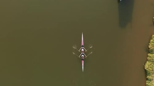 Two seat Sport Kayaks rowing on tranquil river water, Aerial view.