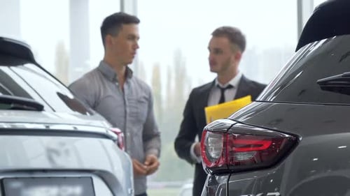 Car Dealership, Man Talking with Salesman