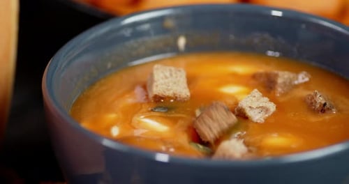 Close Up Pumpkin Soup with Croutons in Bowl