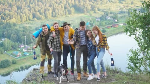 Young Group of Hikers Walking in the Forest