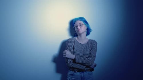 Stylish Person with Blue Hair Posing