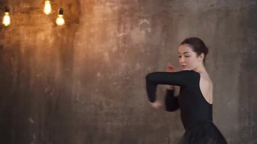 Elegant Woman Dancing Gracefully in Studio