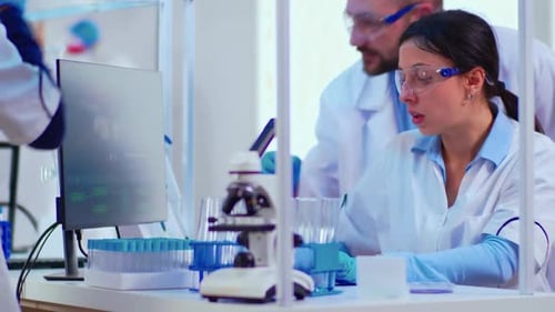 Scientists Analyzing Data in Modern Laboratory