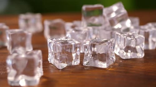 Clear Ice Cubes on Wood Surface