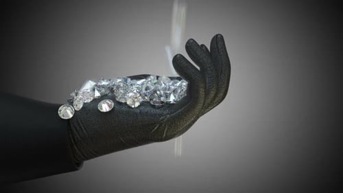 Diamonds Falling into a Gloved Hand