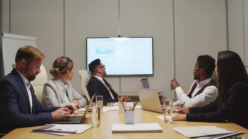 Business Professionals in Modern Workplace Conference Meeting