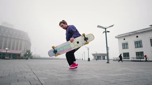 Close Up of Young Man Professional Skater Rides Skateboard or Longboard Swerves and Sways with Flow