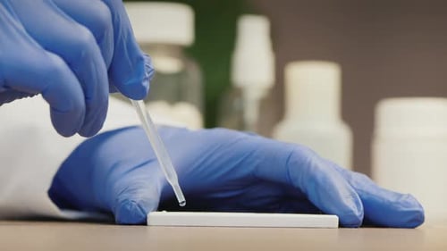 Performing Medical Test with Dropper Close Up
