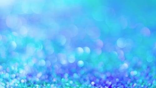 Abstract Turquoise Glittering Bokeh Lights Background