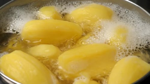 Boiling Potatos in Water in Saucepan