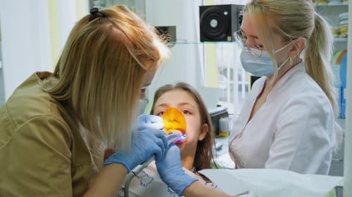 Child at Dentist Getting Dental Treatment