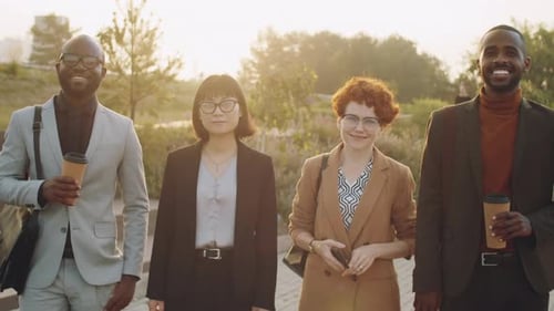 Diverse Team Smiling Outdoors in Urban Park