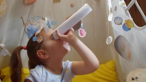 Girl With Homemade Telescope Plays in Space Fort