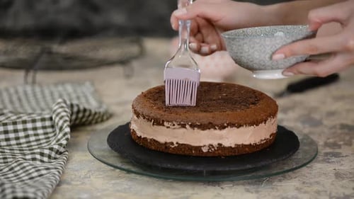 Icing Top Layer on a Chocolate Cake