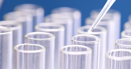 Liquid Drops from Pipette into Test Tubes