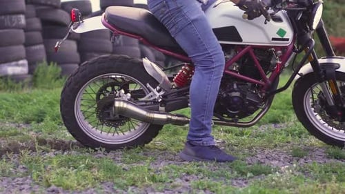 Motorcycle Kicks Up Dirt in Rural Setting