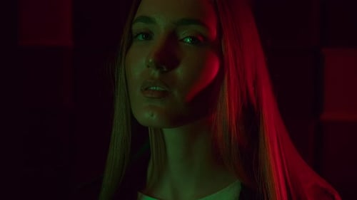 Woman Posing with Red and Green Lighting