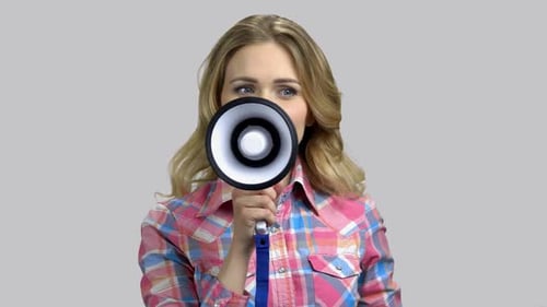 Woman Speaking Into a Megaphone Close Up