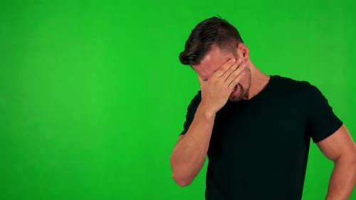 Young Handsome Caucasian Man Cries - Green Screen - Studio