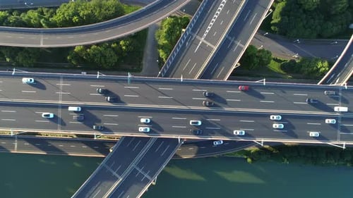 Aerial Drone View of Highway Multilevel Junction Road with Moving Car at Sunset