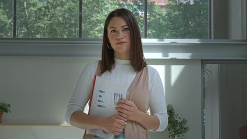 Spanish Woman Looking at Camera Seriously in an Office