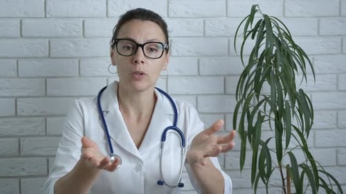 Woman Doctor Talking to Camera Indoors