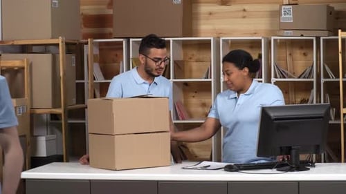 Three Post Office Clerks Working Together in Branch Office